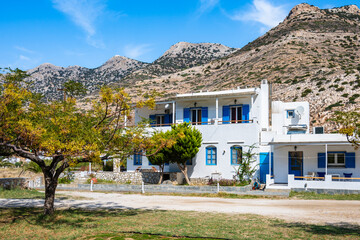 Typical holiday apartment building for rent with blue window shutters in Kamares village, Sifnos...