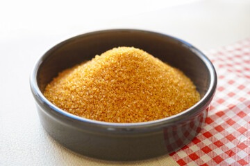 Close-up of brown sugar on  white background