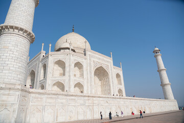 Fototapeta premium Agra, India, March 2024: The Taj Mahal, a white marble mausoleum located in Agra, Uttar Pradesh, recognized as the jewel of Muslim art in India and one of the universally admired masterpieces