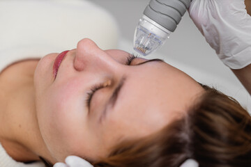 Treatment of women's facial skin in a beauty salon.