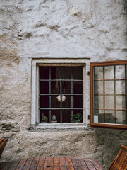 old vintage window in a clay building