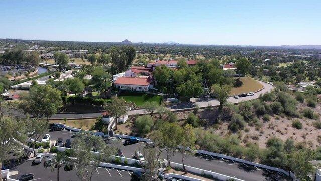 Wrigley Mansion at the Arizona Biltmore in Phoenix, Arizona with mountains and the Phoenix skyline in the background