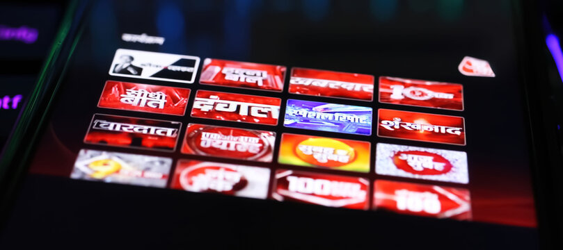 Viersen, Germany - May 9. 2024: Smartphone with logo lettering of indian hindi AAJ TAK smart TV App on computer keyboard