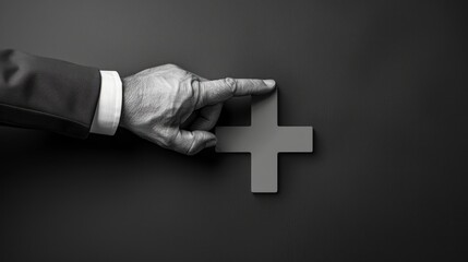 A hand pointing to a cross on a wall with copy space