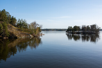 Concept of lonely island landscape: Kaninholmen - Swedish island,  lonely island surrounded by water, beautiful place on sunny evening