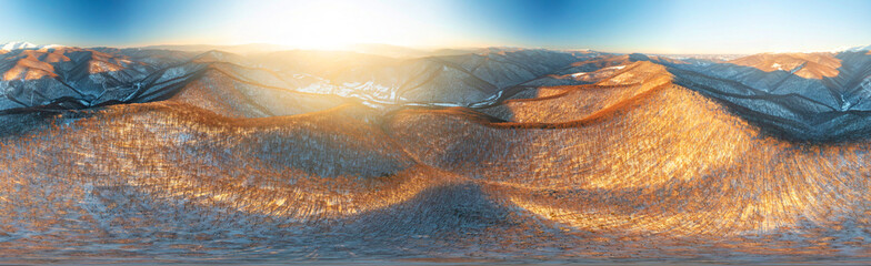 Severe frost at sunrise in the Carpathians, Transcarpathia, Ukraine. A drone flies over the tops of...