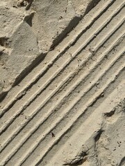 Relief on the sand from tyres.