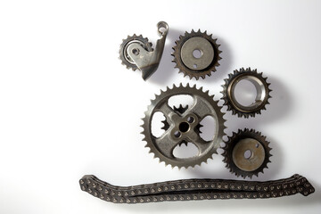 gears of the valve timing mechanism of internal combustion engines, on a black background,close-up