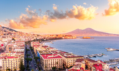 beautiful panorama of Naples city with amazing coast, sea port, streets and buildings and volcano...