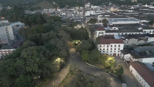 Popayan town in Colombia, close to Cali its a beautiful colonial town in white buildings and roofs that combine very good with the view from the air, drone scenes all over town and the sky, 