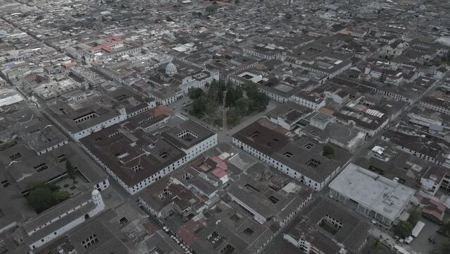 Popayan town in Colombia, close to Cali its a beautiful colonial town in white buildings and roofs that combine very good with the view from the air, drone scenes all over town and the sky, 