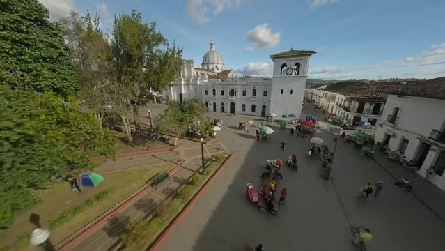 Popayan town in Colombia, close to Cali its a beautiful colonial town in white buildings and roofs that combine very good with the view from the air, drone scenes all over town and the sky, 