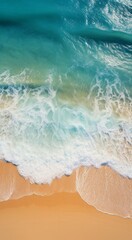 Obraz premium Aerial View of Beach With Waves and Footprints