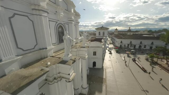 Popayan town in Colombia, close to Cali its a beautiful colonial town in white buildings and roofs that combine very good with the view from the air, drone scenes all over town and the sky, 