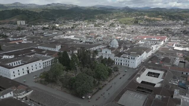 Popayan town in Colombia, close to Cali its a beautiful colonial town in white buildings and roofs that combine very good with the view from the air, drone scenes all over town and the sky, 
