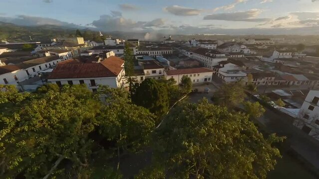 Popayan town in Colombia, close to Cali its a beautiful colonial town in white buildings and roofs that combine very good with the view from the air, drone scenes all over town and the sky, 