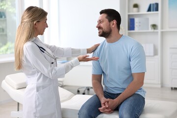 Fototapeta premium Professional doctor working with patient in hospital