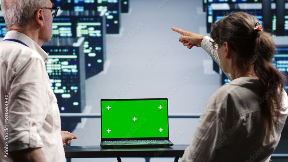 Poster coworkers in server farm housing high end processors capable of quickly and efficiently performing c