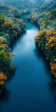 Blue River Winding Through Lush Green Mountainside