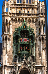 Panoramic view of theatrical puppet show on tower in Marienplatz town hall of Marien Square in...