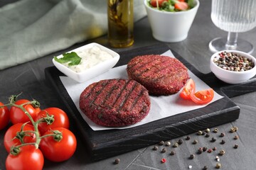 Tasty fried vegetarian cutlets served on grey table