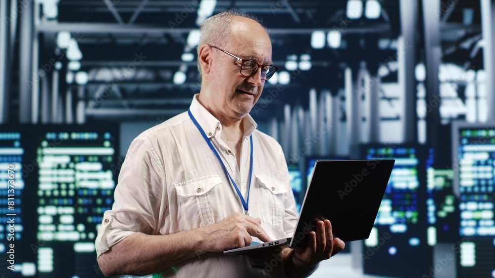 Poster certified it professional navigating network of servers in industrial space. admin with laptop ensur