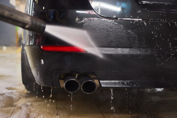 Foam covers car in garage tires, wheels, lights, hood, automotive design