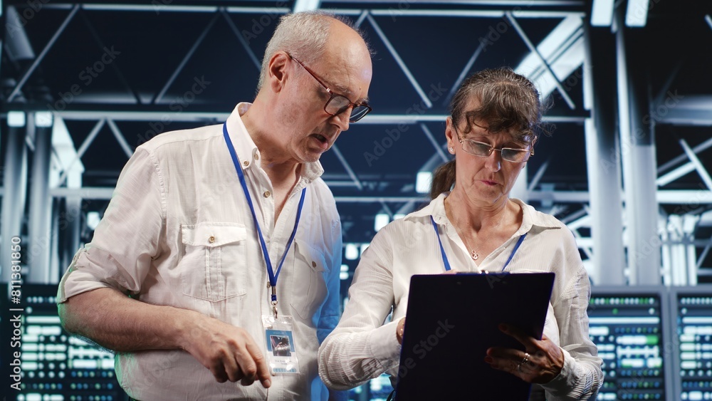 Poster senior workers monitoring green energy server farm infrastructure. electronics using renewable sourc