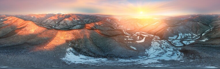 Severe frost at sunrise in the Carpathians, Transcarpathia, Ukraine. A drone flies over the tops of...