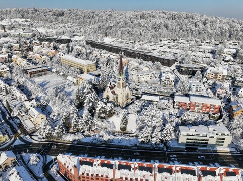 aerial view of a church in snowed in zurich