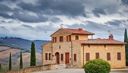 poggio covili farmhouse at orcia valley against cloudy sky - Powered by Adobe