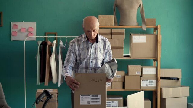 Startup small business SME, Entrepreneur owner old man to preparing pack product box for online parcel delivery.