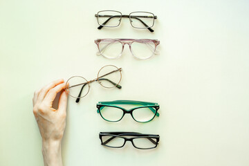 Eyeglasses top view. Comparing lenses in optics store