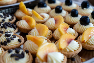 coffee break hotel during conference meeting, corporate revent with tea and coffee catering, decorated catering banquet table with variety of different pastry and bakery, with croissants and cookies