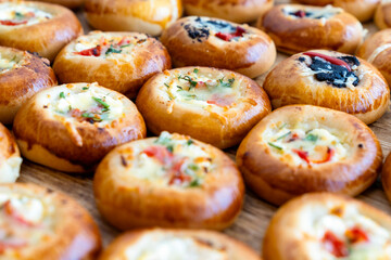 coffee break hotel during conference meeting, corporate revent with tea and coffee catering, decorated catering banquet table with variety of different pastry and bakery, with croissants and cookies