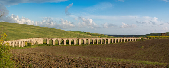 Historic Aqueduct in Rural Landscape
