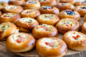 coffee break hotel during conference meeting, corporate revent with tea and coffee catering, decorated catering banquet table with variety of different pastry and bakery, with croissants and cookies