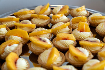 coffee break hotel during conference meeting, corporate revent with tea and coffee catering, decorated catering banquet table with variety of different pastry and bakery, with croissants and cookies