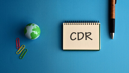 There is notebook with the word CDR. It is an abbreviation for Carbon Dioxide Removal as...