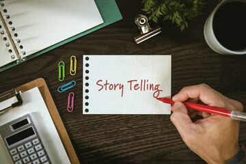 There is notebook with the word Story Telling. It is as an eye-catching image.