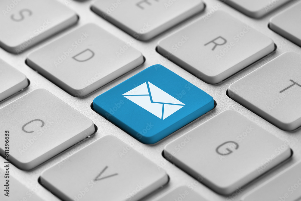 Aufkleber email. light blue button with illustration of envelope on computer keyboard, closeup