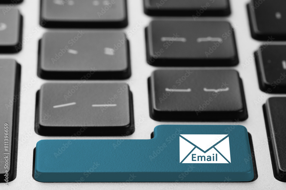 Poster light blue button with word email and illustration of envelope on keyboard, closeup