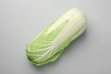 Fresh ripe Chinese cabbage on grey background, top view