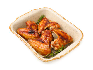 Fresh marinated chicken wings and rosemary in baking dish isolated on white
