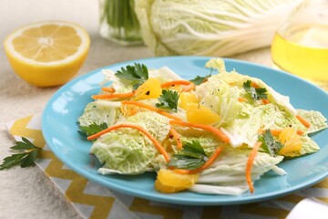 Tasty salad with Chinese cabbage and products on beige table, closeup