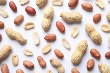 Fresh peanuts on white background, flat lay