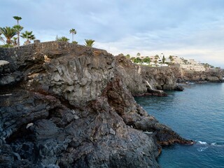 Sunset on the frozen lava coast at Punta Delioma, Las Galletas, Arona, Tenerife, Atlantic Ocean,...