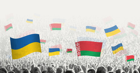 People waving flag of Belarus and Ukraine, symbolizing Belarus solidarity for Ukraine.