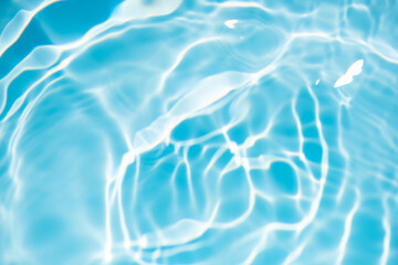 Blue water with ripples on the surface. Defocus blurred transparent blue colored clear calm water...