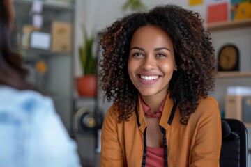 Smiling Female Manager Interviewing an Applicant In Office